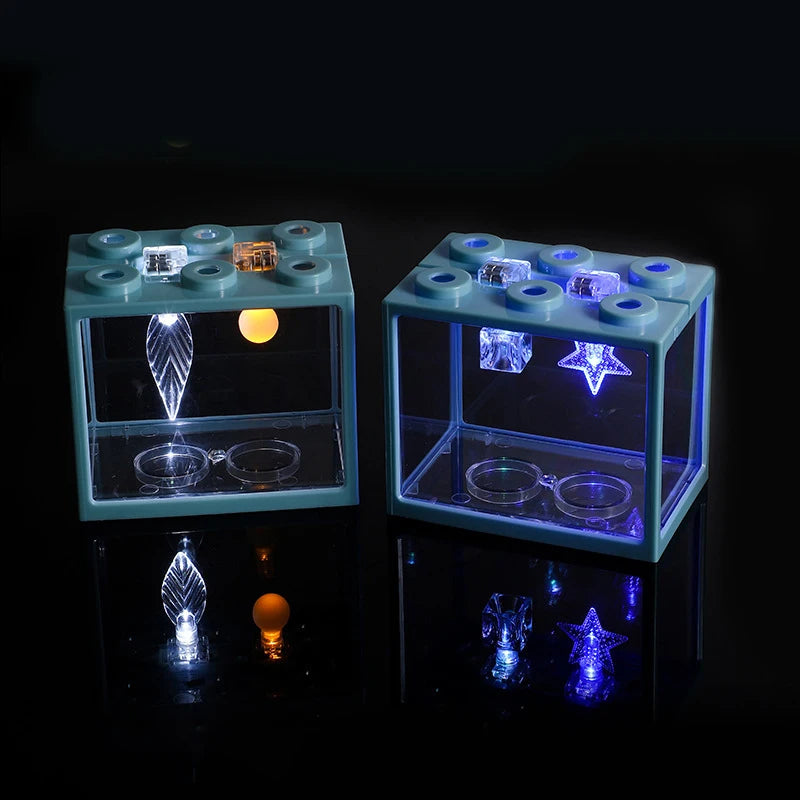 Acuario LED decorativo pequeño para mascotas por Happy Pets LS, con iluminación brillante y diseño colorido para acuarios.